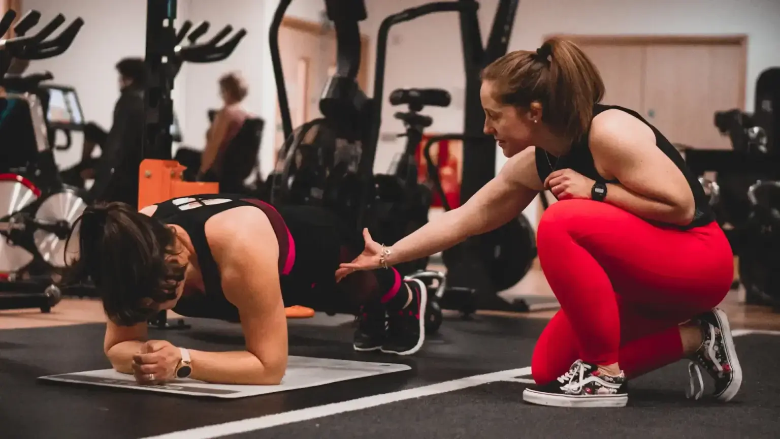 Work Train Fight trainer providing guidance for strength training