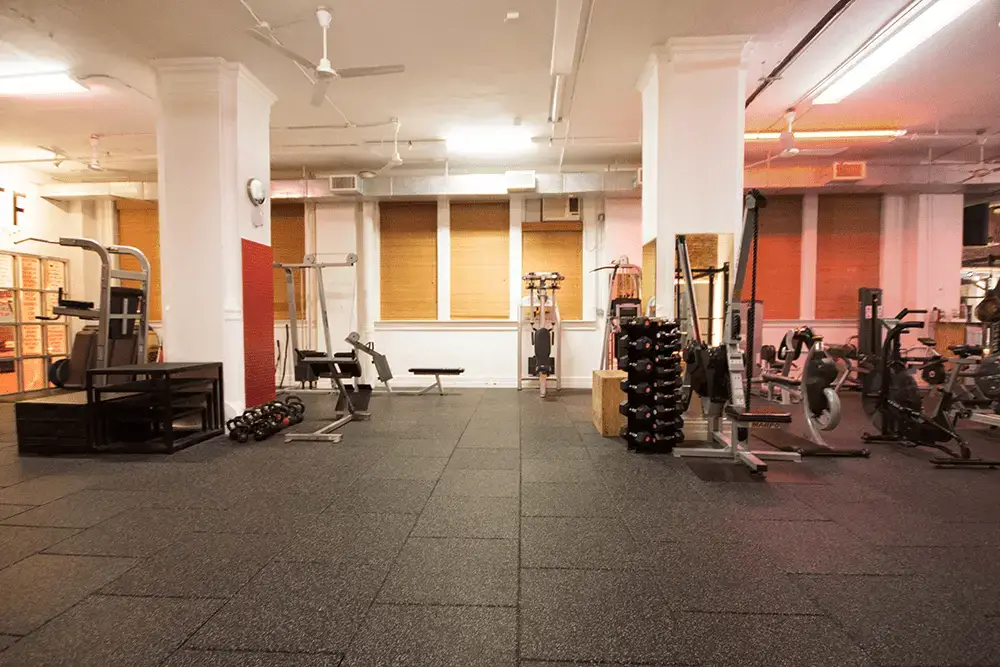 Work Train Fight workout area has plenty of strength and cardio machines as well as open floor space.